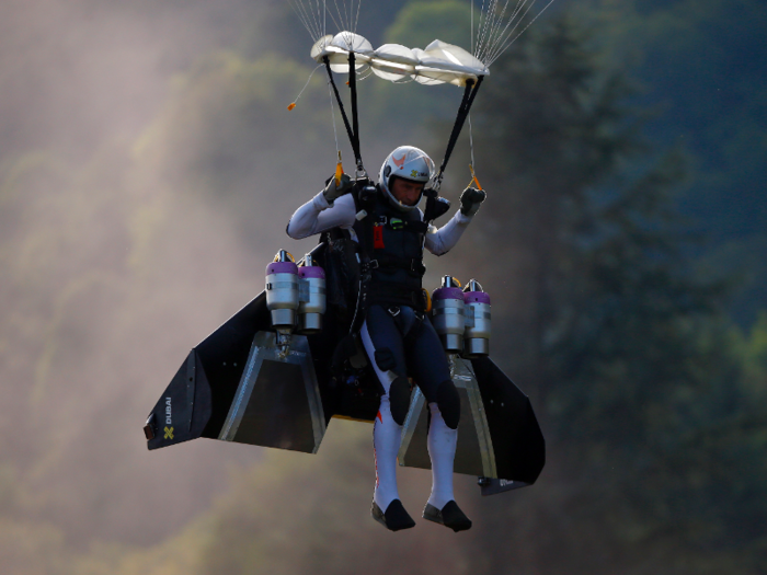 In North Wales, Paul Cox commutes to work using a motor-powered paraglide.