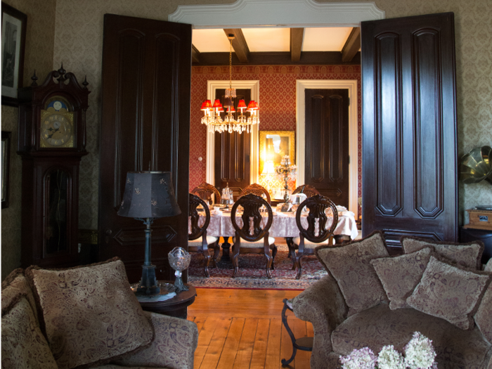 Through a pair of doors is the formal dining room.