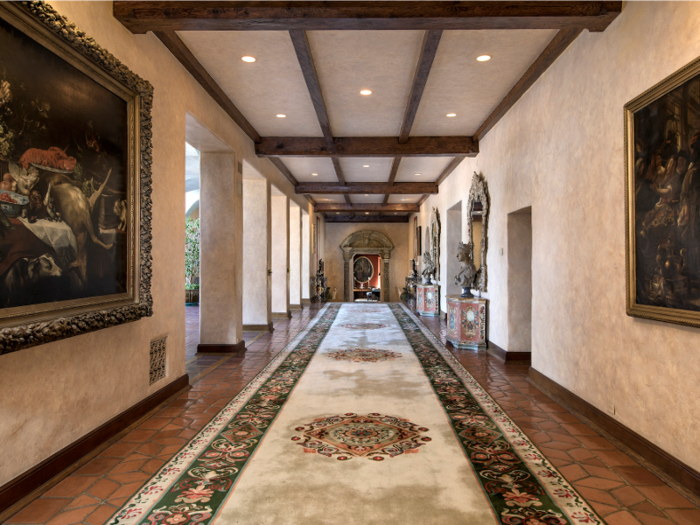 A stroll through the house would take you through its grand hallways, one of which is 82 feet long and the other more than 102 feet with a 40-foot wide mural.