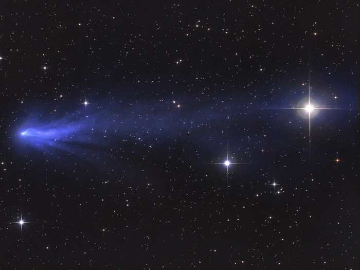 When sunlight strikes the carbon monoxide gases of Comet C/2016 R2, the molecules fluoresce a bright blue color. This stunning picture was highly commended by contest judges.