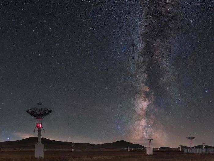 Radio dishes designed to study the sun seem to gaze at the Milky Way galaxy in this picture.