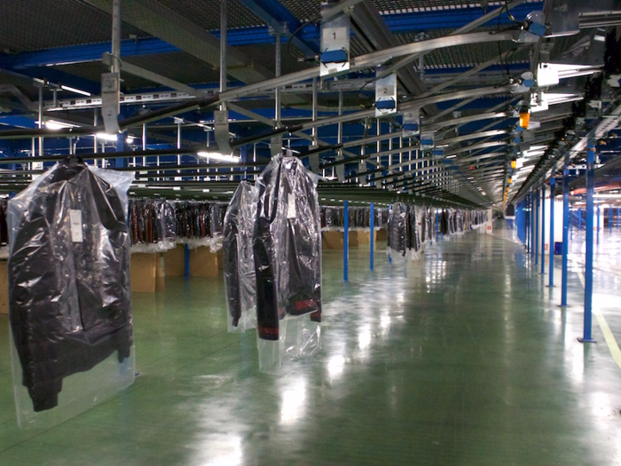 In a separate corner of the distribution center, hanging garments that have passed the separate quality-control process are also waiting to be shipped.