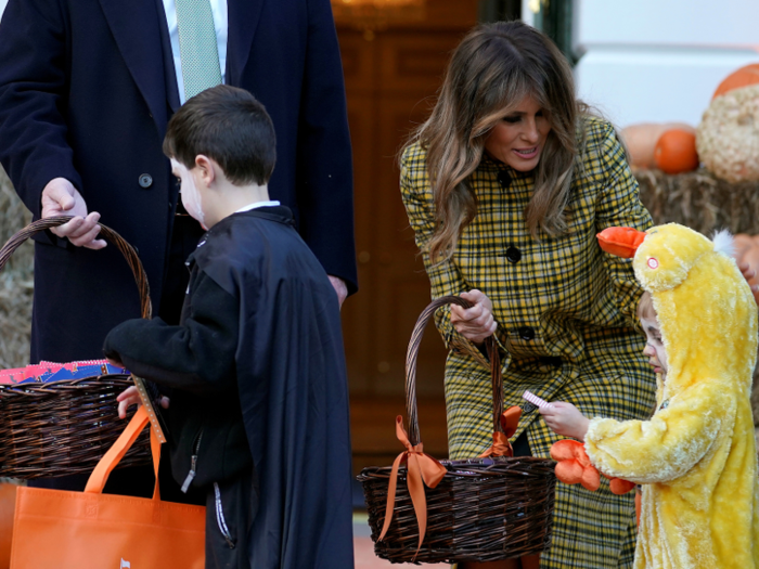 The Trumps were all smiles as they handed out candy.