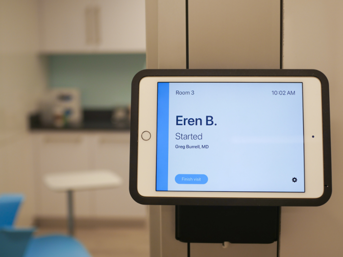 An iPad placed on the wall of each treatment room displayed the patient