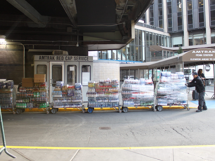 They brought the carts to the loading area. Each cart weighs a maximum of 175 pounds. The two men had to throw their weight against the carts to move to them to the entrance — it looked strenuous.