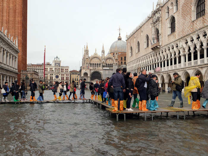 Residents and tourists alike struggled to get around the city in tall rain boots.