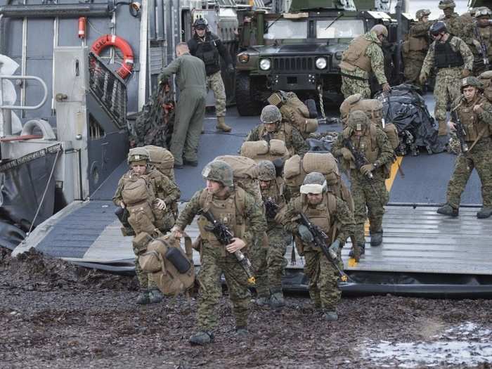 U.S. Marines with 24th Marine Expeditionary Unit conduct an amphibious landing from ship to shore, carried on a Landing Craft Air Cushion (LCAC), during Exercise Trident Juncture 18 in Alvund, Norway, Oct. 29, 2018.