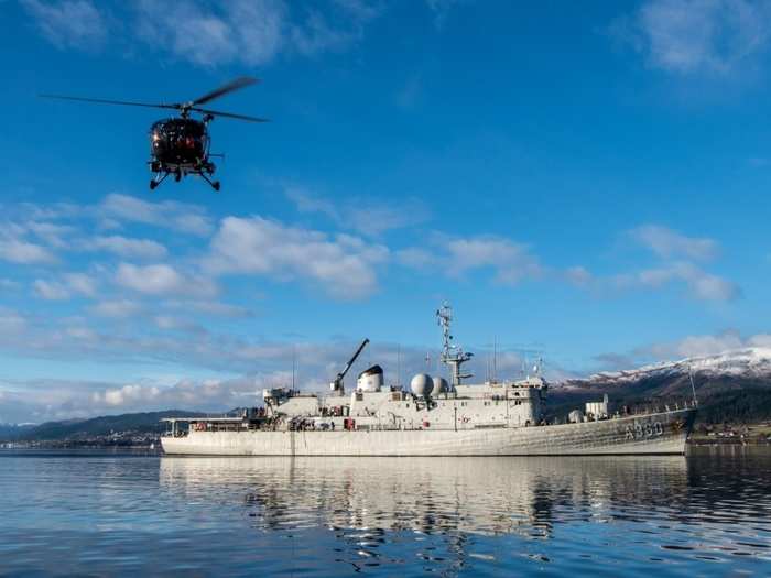 A Belgian Air Force Alouette III helicopter takes off from mother ship BNS Godetia for a tactical flight over the fjords October 27, 2018 in support of an amphibious landing.