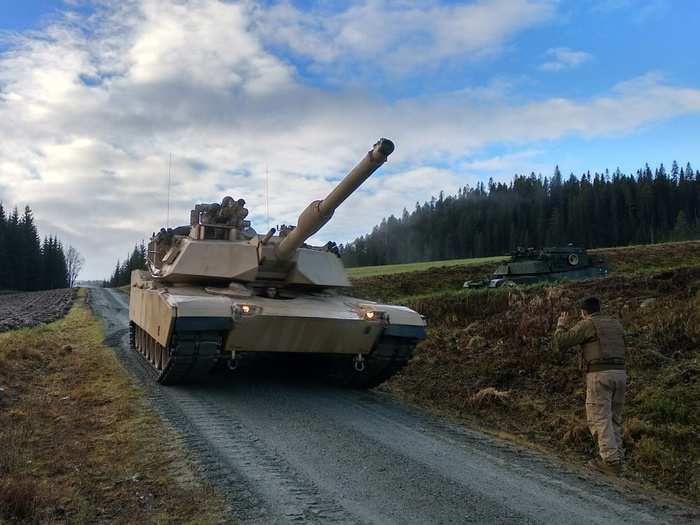 U.S. Marines from 2nd Tank Battalion, 2nd Marine Division, use their M1A1 Abrams tank to practice recovering an Assault Breacher Vehicle during the Combat Enhancement Training/Force Integration Training phase near Storås, Norway, Oct. 26, 2018.