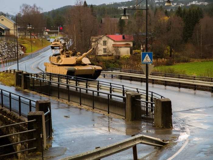 U.S. Marines with 2nd Tank Battalion, 2nd Marine Division, drive a M1A1 Abrams tank during the Combat Enhancement Training/Force Integration Training phase of Excercise Trident Juncture 18 near Storås, Norway, Oct. 25, 2018.