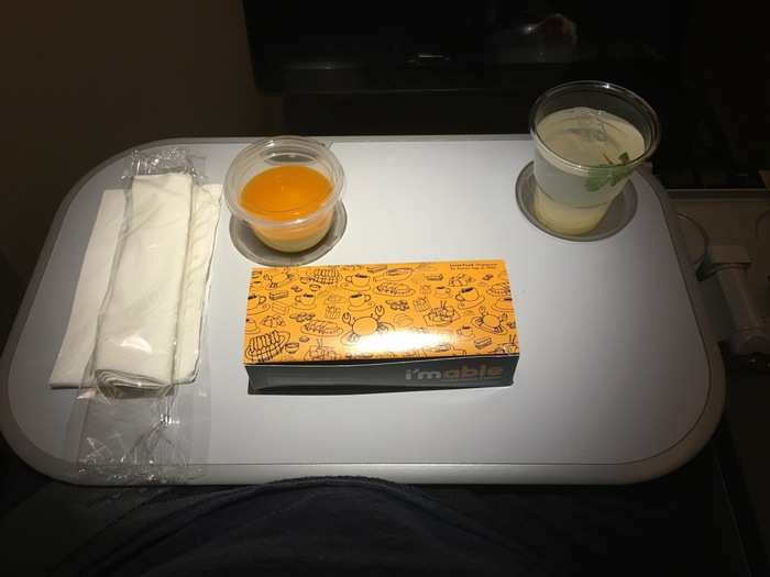 Nine hours into the flight, the crew came around with another round of refreshments.