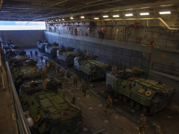 Marines board amphibious assault vehicles during the landing exercise.