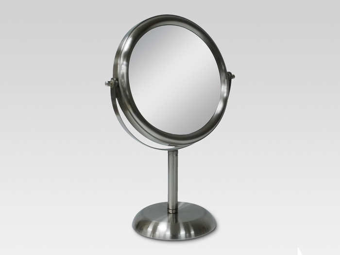 An elegant dual-sided vanity mirror