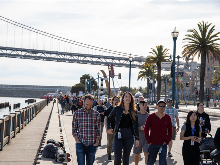 Some continued to participate in chants, but most were quiet as they walked toward the city