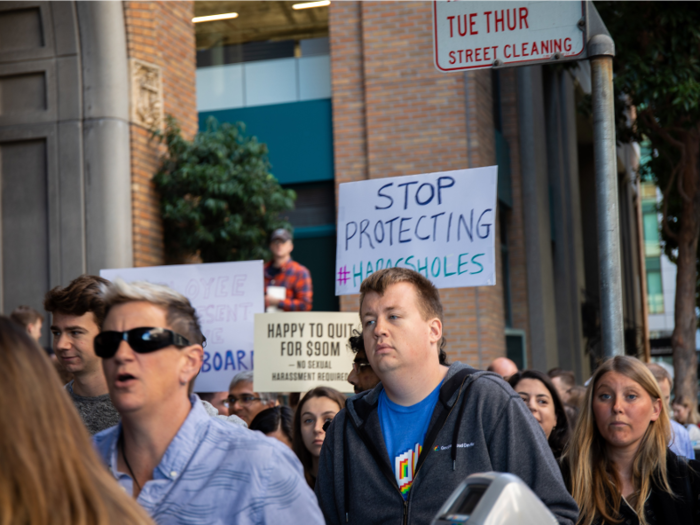 Other banners demanded that "hara--holes" within the company be held accountable for their actions.