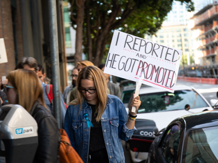 Many women wore teal ribbons on their lapels, a sign of solidarity with women who have survived sexual harassment.