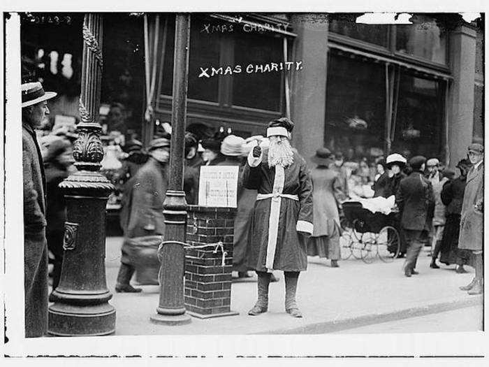 Men dressed as Santa stood in the streets, collecting charity donations ...