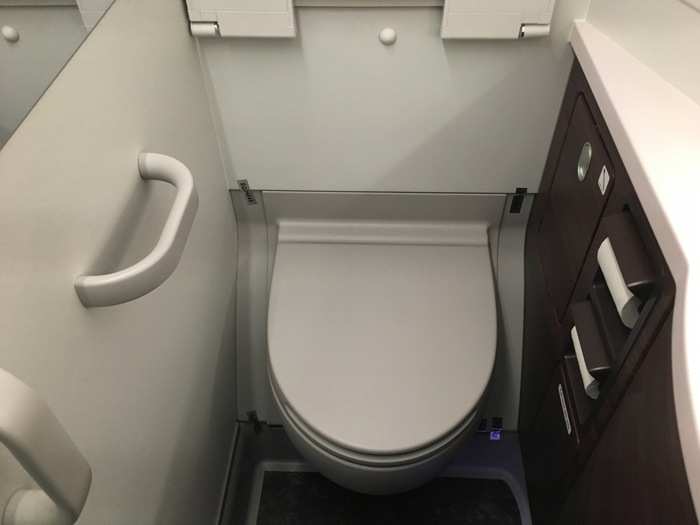 The premium economy bathroom is noticeably smaller than its business class counterpart.