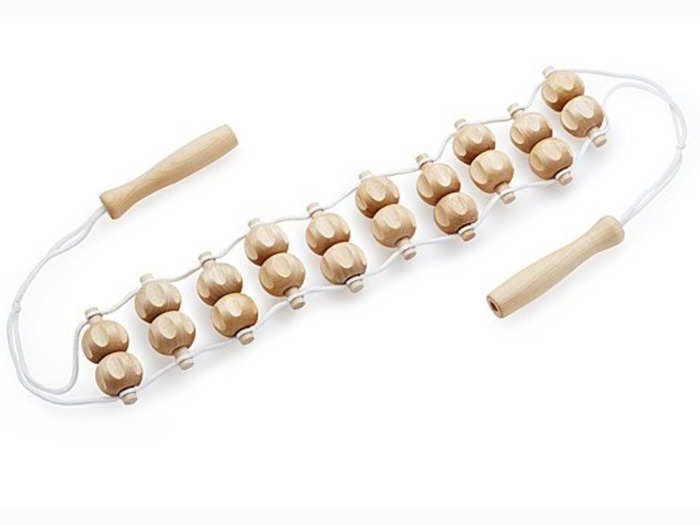 A handmade wooden back massager