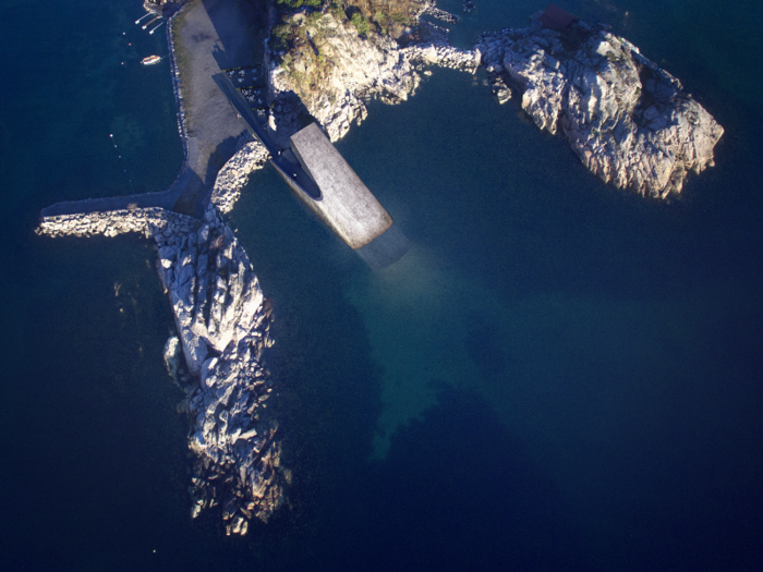 The 100-foot long structure resembles a concrete tube that sits half-in and half-out of the sea. It rests on the seabed about 16.5 feet below the surface.