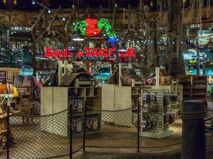 Since there are no windows, the interior feels like being in a massive swamp community trapped in a perpetual state of twilight, with shoppers and gawkers roaming amongst the Bass Pro Shops wares.