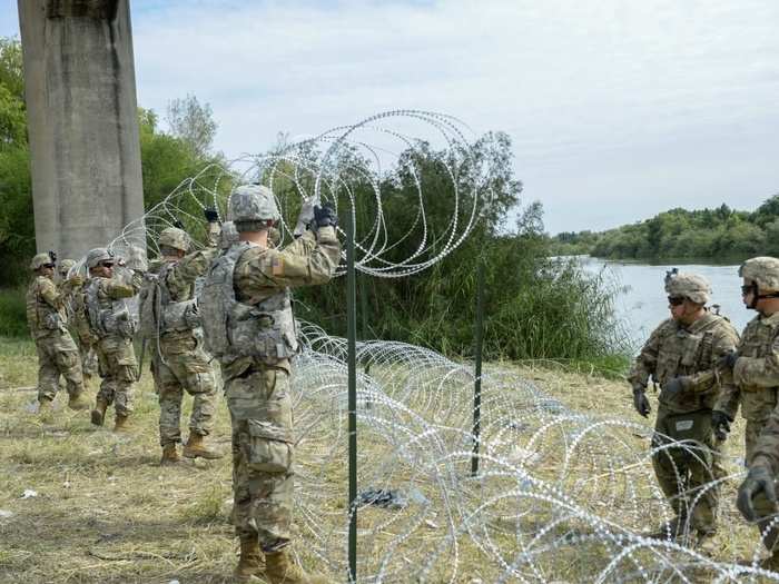 US troops deployed with enough concertina wire already in position to cover 22 miles, with officials noting that the military had the capability to run wire along another 120 miles if necessary.