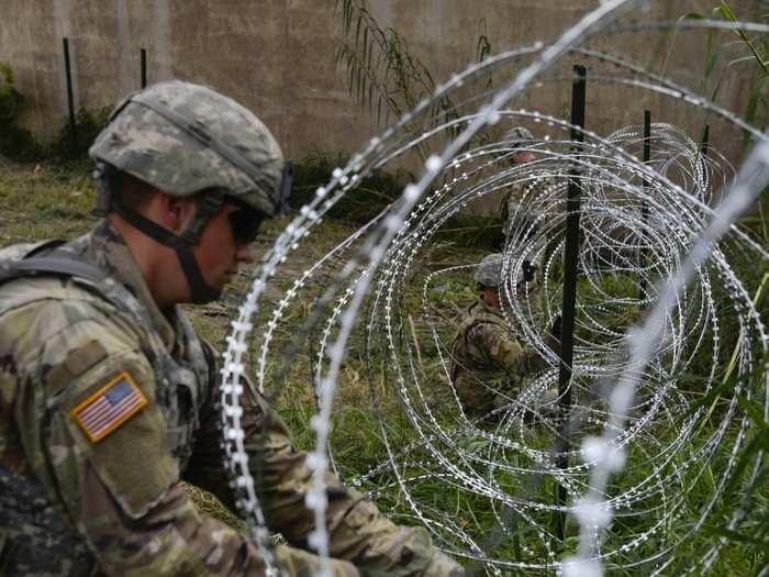 Soldiers from the 97th Military Police Brigade, and 41st Engineering Company, Fort Riley, Kansas, run 300 meters of concertina wire along the border in support of CBP operations in Hidalgo, Texas.