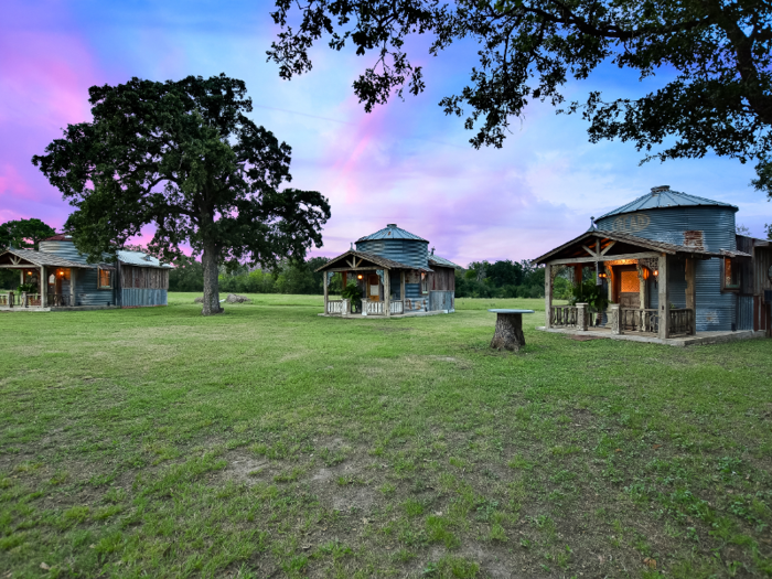 The four-bedroom house is about 2,740 square feet, and the three silos serve as guest homes.