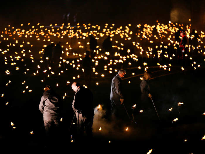 Volunteers, many of whom had a family connection to the war, also helped the Beefeaters light the torches.