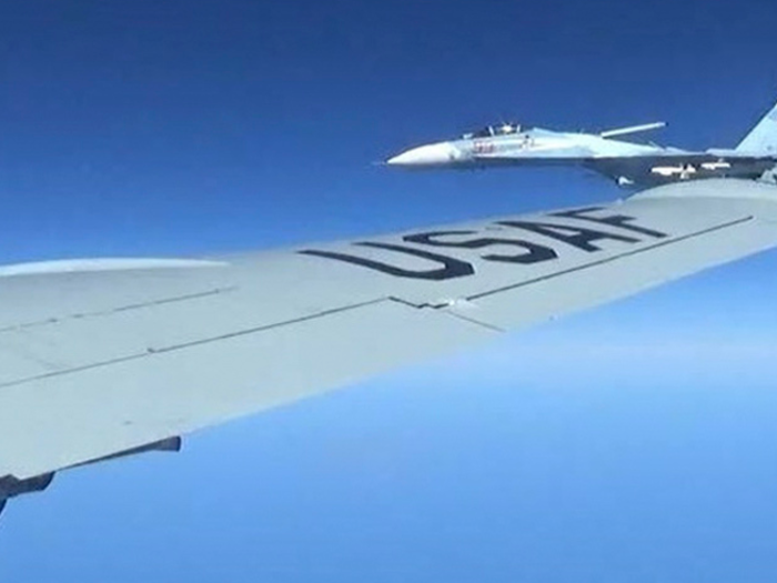 Russian Su-27 Flanker "barrel rolls" over a US Air Force RC-135 reconnaissance aircraft over the Baltic Sea on April 29, 2016.