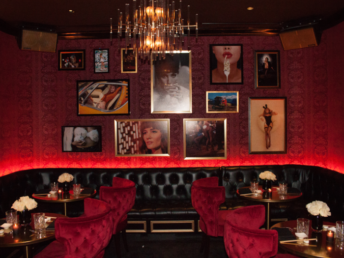 My tour took me deeper into the club to the lounge areas, which are decked out in black leather, red wallpaper, red velvet chairs, and plenty of vintage Playboy imagery.