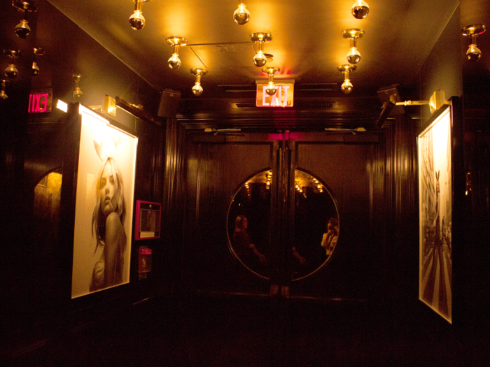 I stepped into the dimly lit entryway, which was all gold tones and glossy black surfaces.