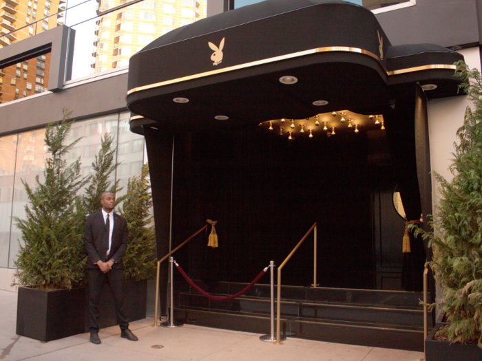 The entrance is black and gold, with the iconic Playboy Bunny logo displayed front and center.