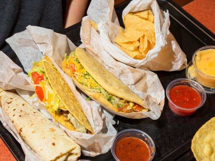 Our order was huge: a #1 combo consisting of a crispy taco, a "Muchacho" beef soft taco, and a bean burrito; a towering taco salad; a "Taco Burger;" and chips with guacamole. Luckily, we came hungry.