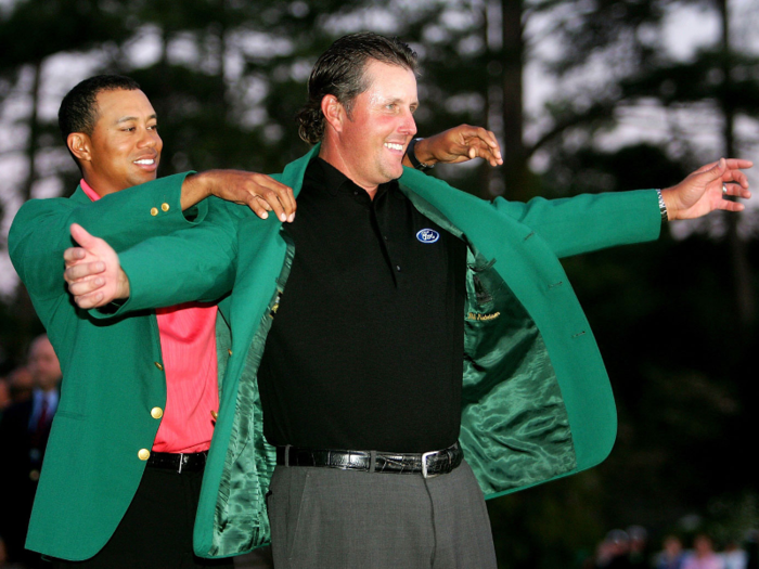 In 2005, Mickelson had to slip the famous green Masters jacket onto Woods, but the following year the roles were reversed.