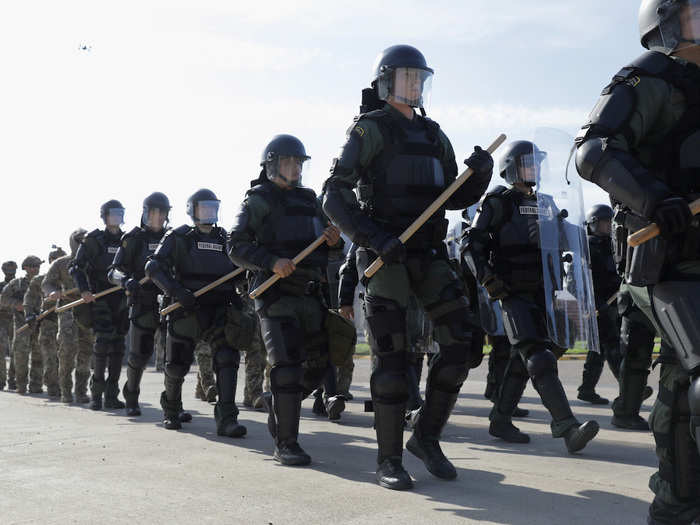 Other Border Patrol units are training in riot gear.