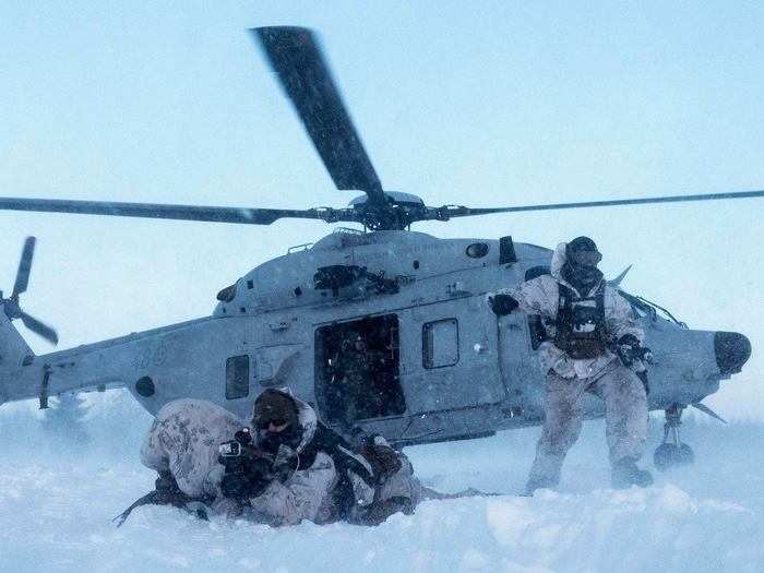 Marines with Marine Rotational Force-Europe move toward their objective during Exercise Winter Sun 18 in Boden, Sweden on March 14, 2018.