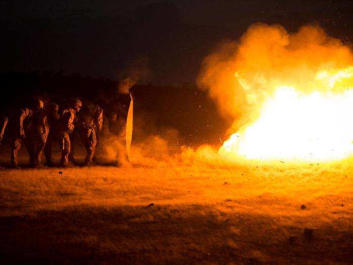 Combat Engineers with the 13th Marine Expeditionary Unit practice breaching techniques during a live fire demolition range at Theater Amphibious Combat Rehearsal (TACR) 18.