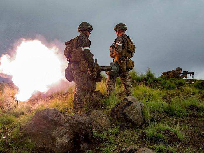 Pfc. Vincent Fiore with Kilo Company, 3rd Battalion, 3rd Marine Regiment fires a Light Anti-Armor Weapon (LAW) during Exercise Bougainville II at the Pohakuloa Training Area on the Island of Hawaii on Oct. 20, 2018.