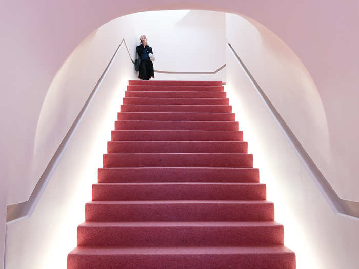 Walking through the doors, I was greeted by a pink staircase with bright lights and high ceilings.