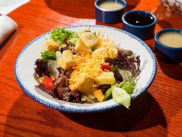 We got salad the way we know one must — simple, with Italian dressing on the side, a fittingly spartan start to the decadent and demanding feast.