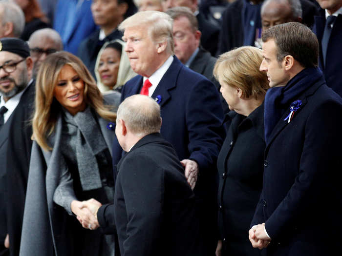 Trump greeted Putin warmly, while Macron and Merkel kept their handshakes brief.