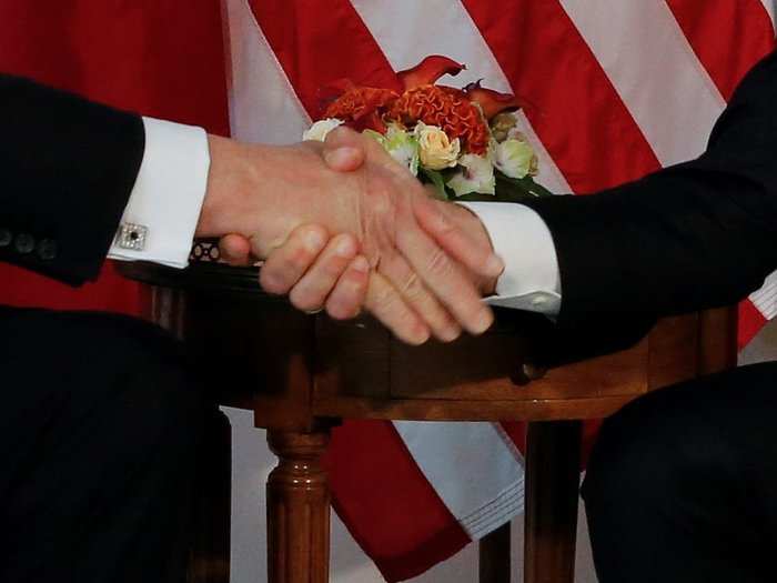 ... and an extended handshake at their first meeting at last year