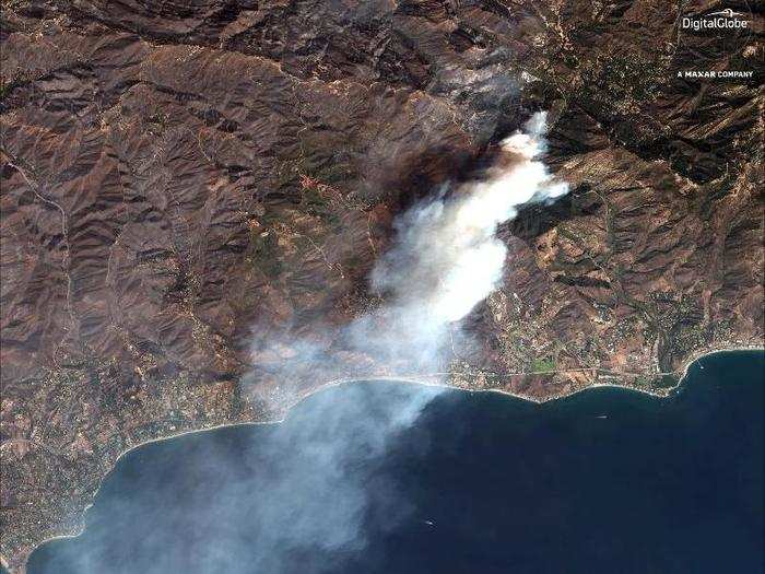 As of Monday morning, the Woolsey Fire had scorched about 92,000 acres of land. This view shows the Malibu area on Sunday.