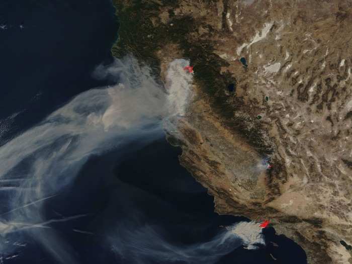 As the Camp Fire raged, the Hill and Woolsey fires also grew, You can see those fires outside of Los Angeles in this satellite image from Saturday.