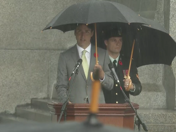  Canadian President Justin Trudeau stands under an umbrella in the rain to honor those who fought during the Dieppe Raid. 