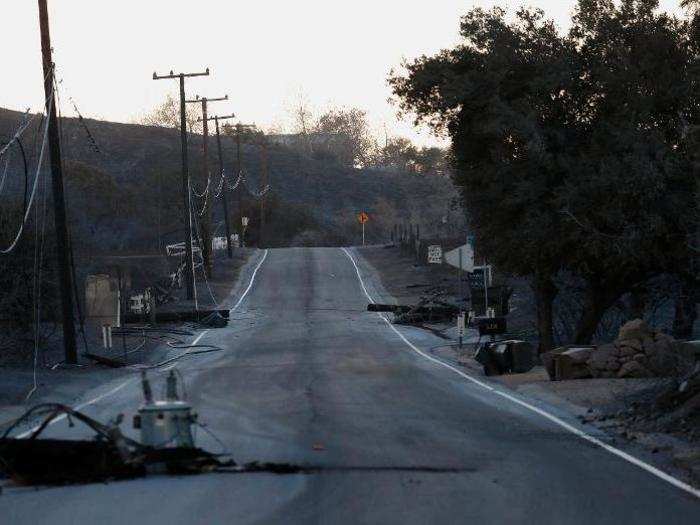 By Sunday, the road was littered with debris and toppled power lines.