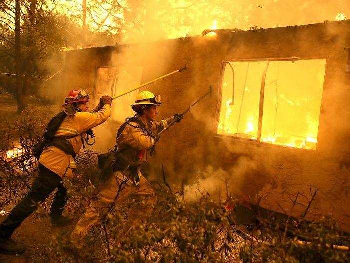 Cathy Fallon told the AP that the fire hit her house like a "big tsunami." She managed to save her 14 horses and barn using a hose.