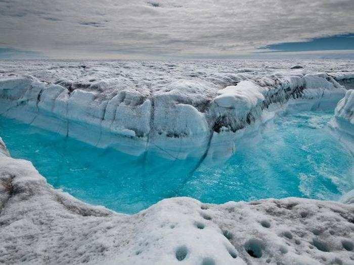 Most of Greenland is covered in an ice, a process that began about 3 million years ago. The ice is nearly 2 miles thick in some locations, which has obscured almost all of the continent