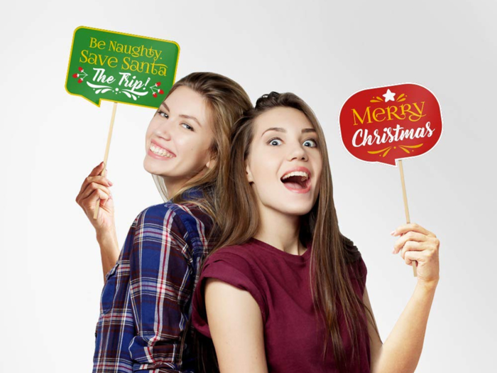 Christmas-themed photo booth props for a fun holiday party activity